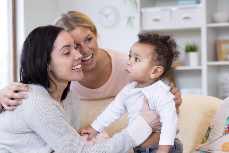 two women and a baby